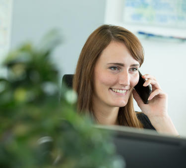 Woman smiling on the telephone